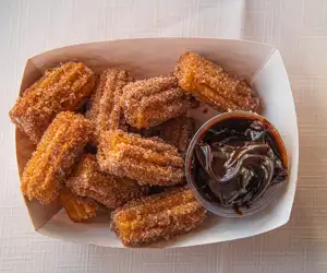 Churros with chocolate dipping sauce at The Avocado Pit in Beverly. 
